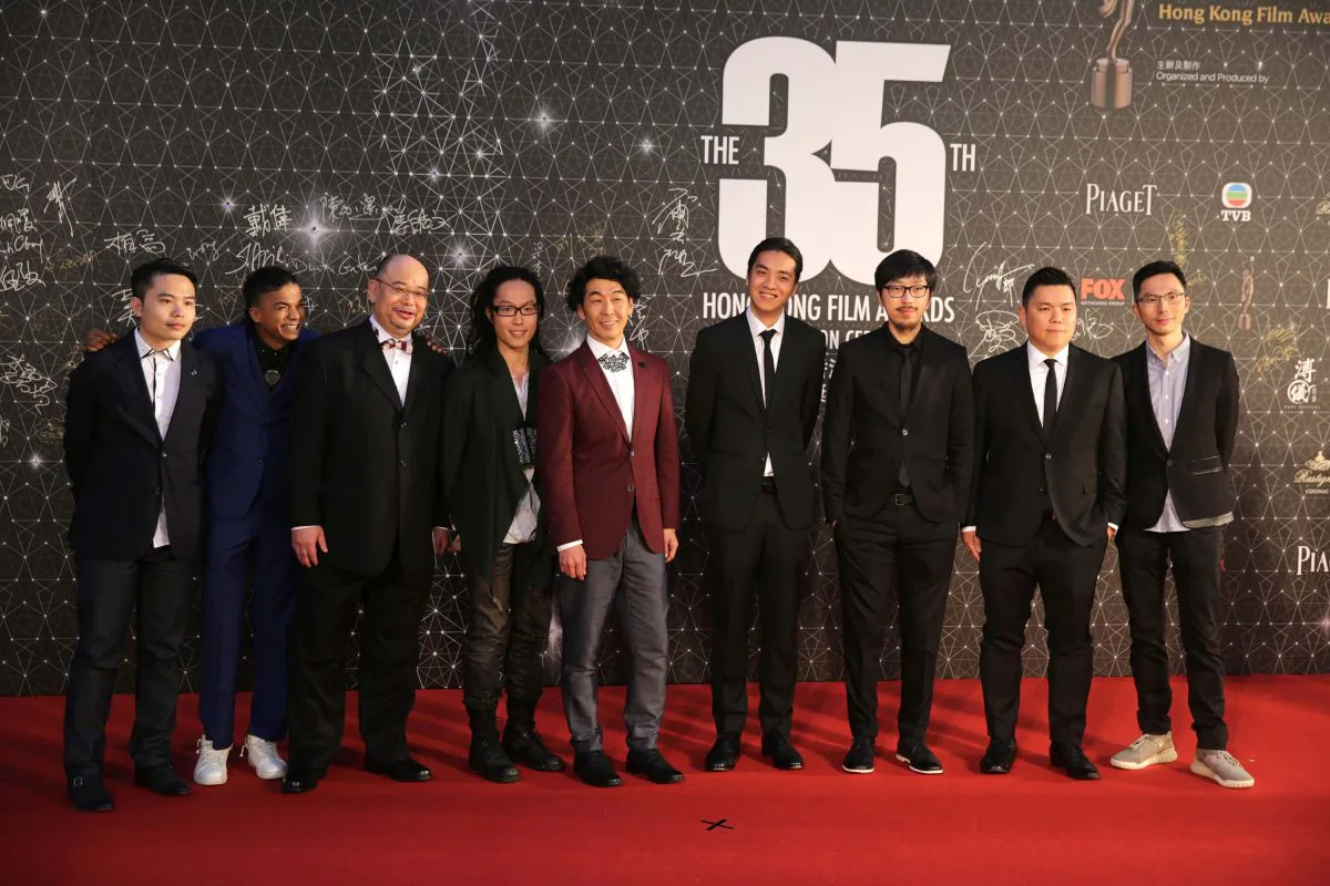 Cast and Crew from the Hong Kong film "Ten Years," pose for a photo on the red carpet at the Hong Kong Film Awards on April 3, 2016.
(Isaac Lawrence/AFP/Getty Images)